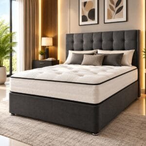 A charcoal grey upholstered bed with a high tufted headboard, a thick white euro-top mattress, and accent pillows, styled inside a contemporary bedroom.