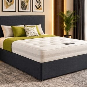Luxury dark grey divan bed with white mattress and green bedding in modern bedroom